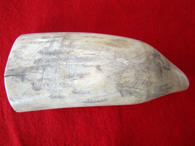 A fascinating 19th century scrimshawed American whale's tooth depicting the boarding of HMS Frolic by the USS Wasp on October 18, 1812. The tooth dates to circa 1838-1880. — image 2